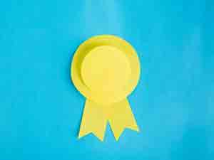 An awards rosette.  Tony is a VOG - Voice of God for awards ceremonies and other events.
